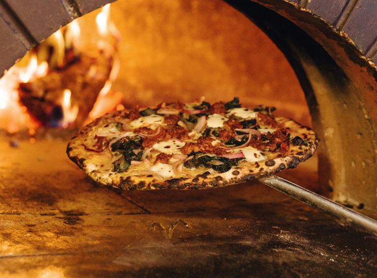 A seasonal wood-fired pizza