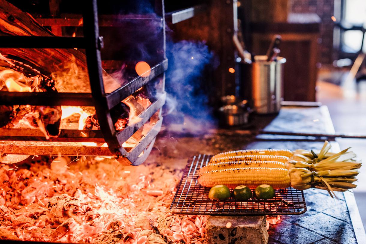 Fresh vegetables and fruits are also charred over the flames.
