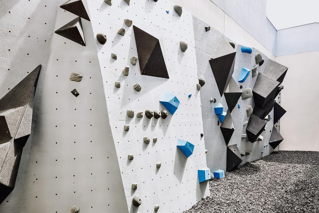 The gym also boasts a 40-foot-wide climbing wall.