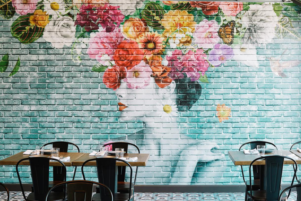 A colorful mural welcomes diners to Pacific Hideaway.