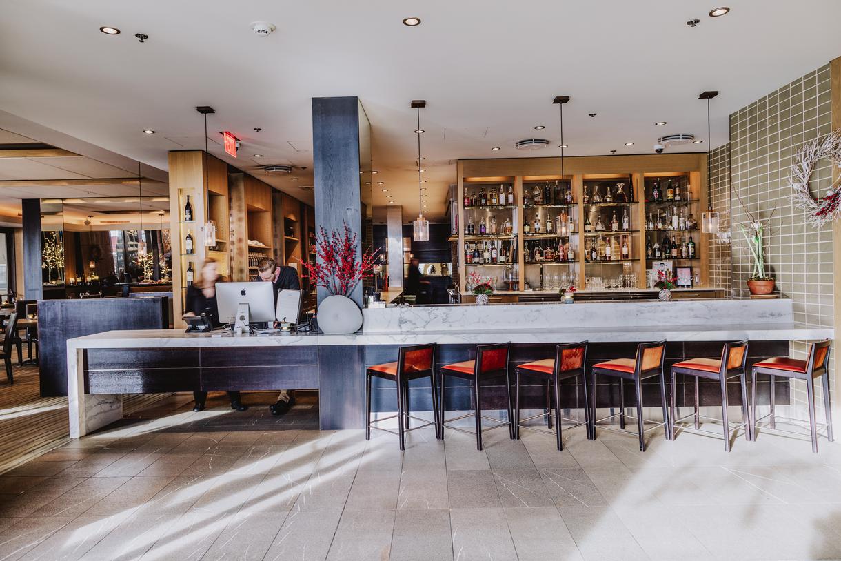 The bar offers a glimpse into the bustling open kitchen.