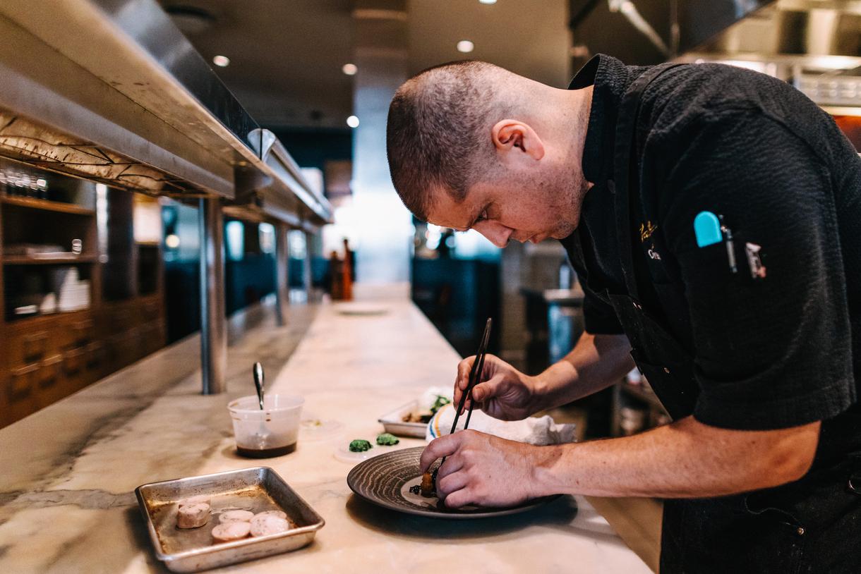 La Toque chefs carefully place every item on the plate.