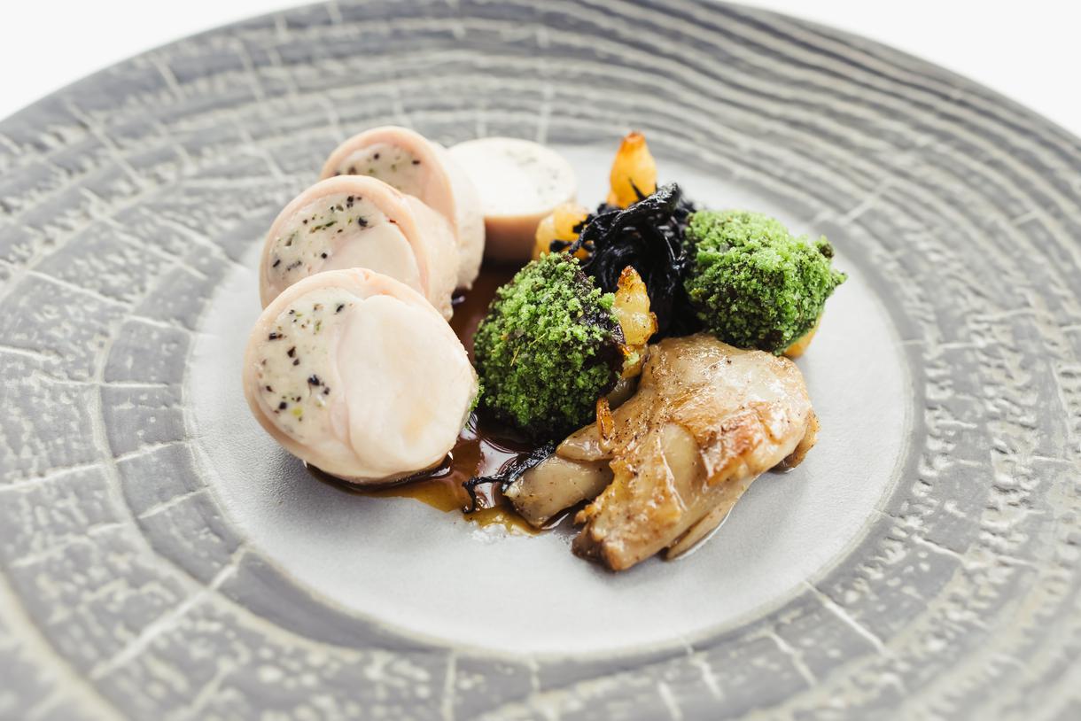Rabbit loin ballotine intermingled with black trumpets and crosnes sassafras rabbit jus.